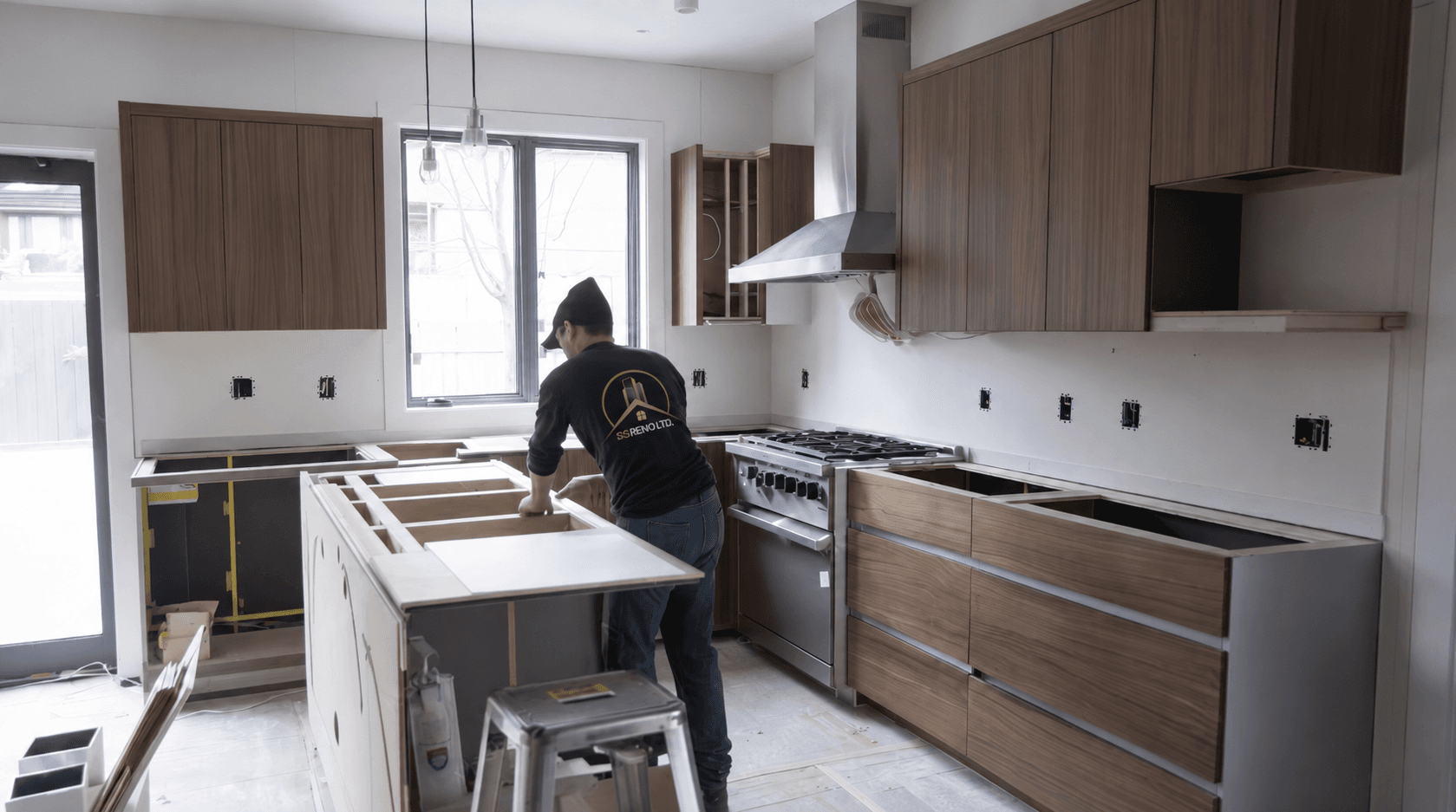 Kitchen before renovation with older cabinetry, counters, and a tighter work area