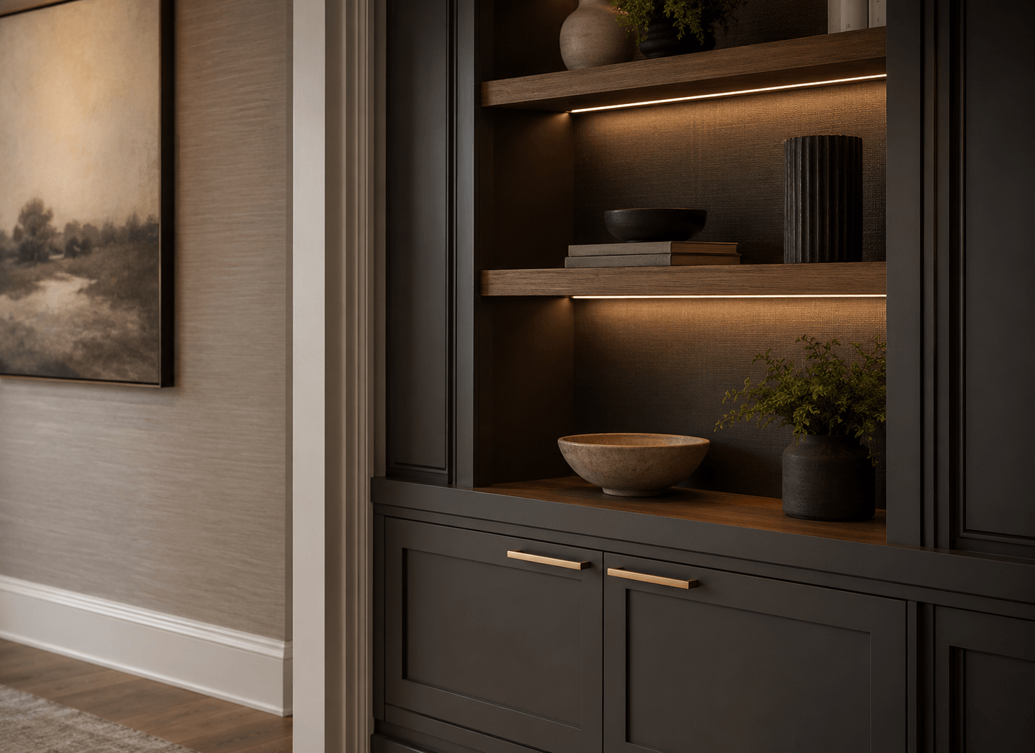Dark custom shelving detail with warm integrated lighting and wood shelves