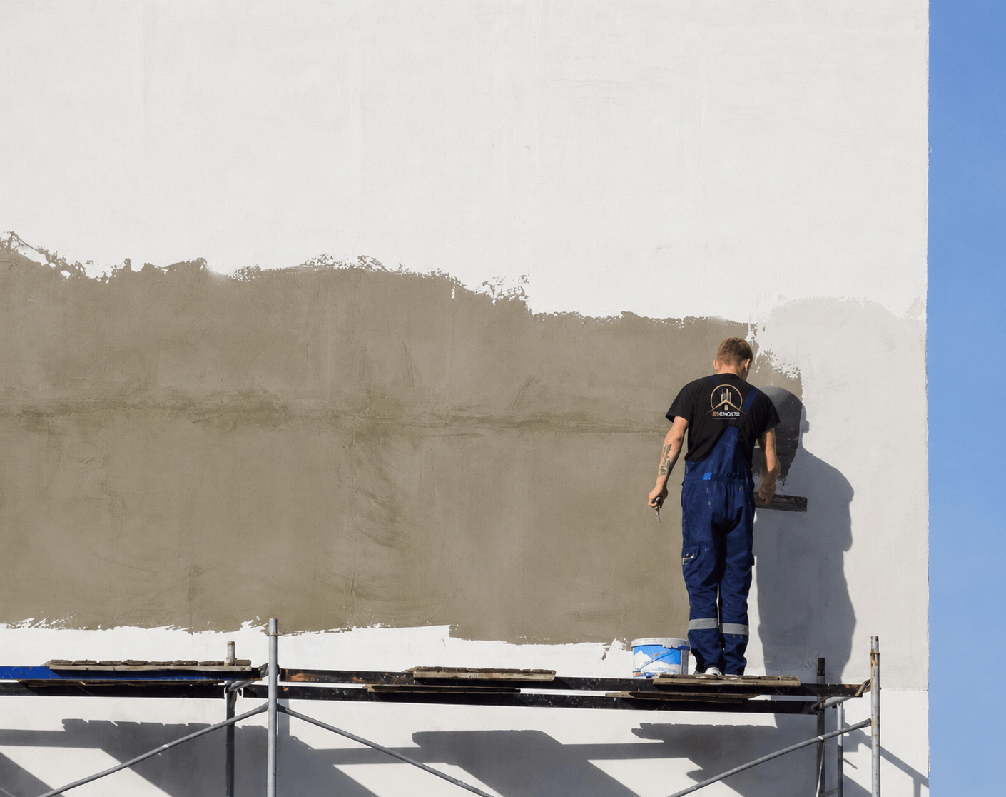 Exterior wall renovation and facade finish work on a residential property
